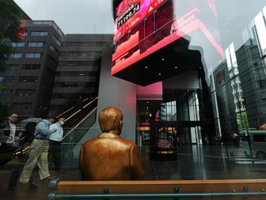 Source-feed image associated with Asian shares retreat in thin holiday trading after a tech-led rally on Wall St