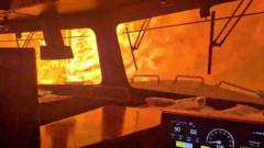 Source-feed image associated with Dramatic video shows wildfire surround freight train in Canada
