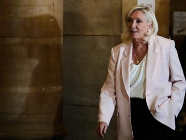 Source-feed image associated with What to know about the electronic monitor a French court says Marine Le Pen must wear