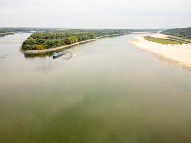 Source-feed image associated with Romania rushes to sink 4 barges in the Danube to keep a nuclear power plant's second reactor running