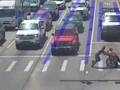 Source-feed image associated with WATCH: Real-life Spider-Man jumps into action to help man cross busy intersection