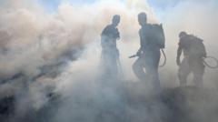 Source-feed image associated with Fires still burn in charred landscape as focus turns to wildfire prevention
