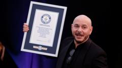 Source-feed image associated with Pitbull fans set world record as 22,000 wear bald caps
