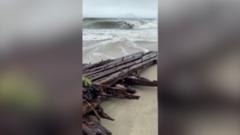 Image from linked report: Watch: Shipwreck uncovered on Nantucket island during nor'easter storm