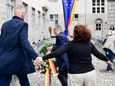 Source-feed image associated with Descendant of Nazi opponent tries to remove far-right party's wreath at Hitler plot memorial event