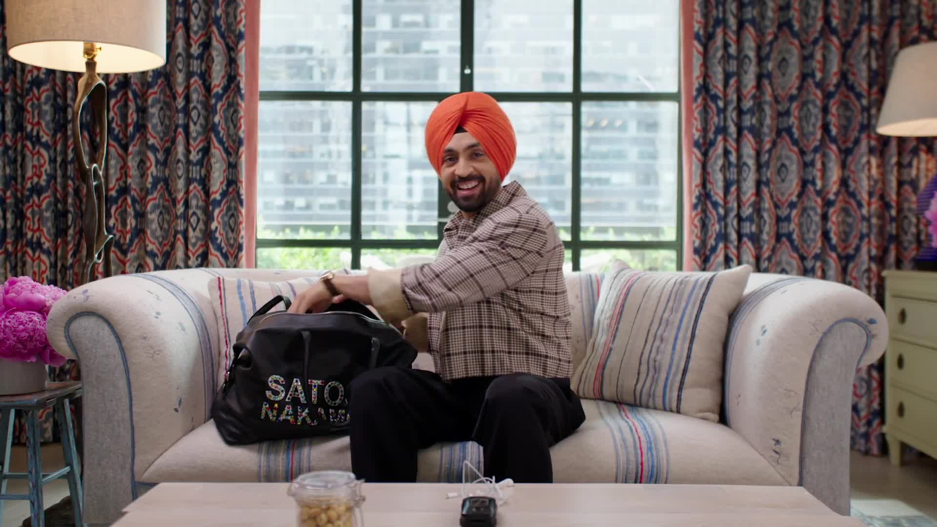 Source-feed image associated with What’s in Diljit Dosanjh’s Bag? Fan-Gifted Jewelry, a Flip Phone, and a Milk Frother