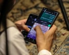 Source-feed image associated with Taliban order ban on smartphones as officials shown destroying devices