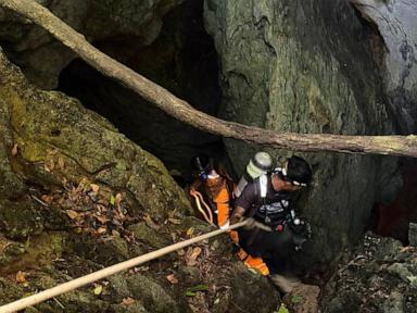 Source-feed image associated with Heavy rains threaten to delay search for 2 people missing in Laos cave