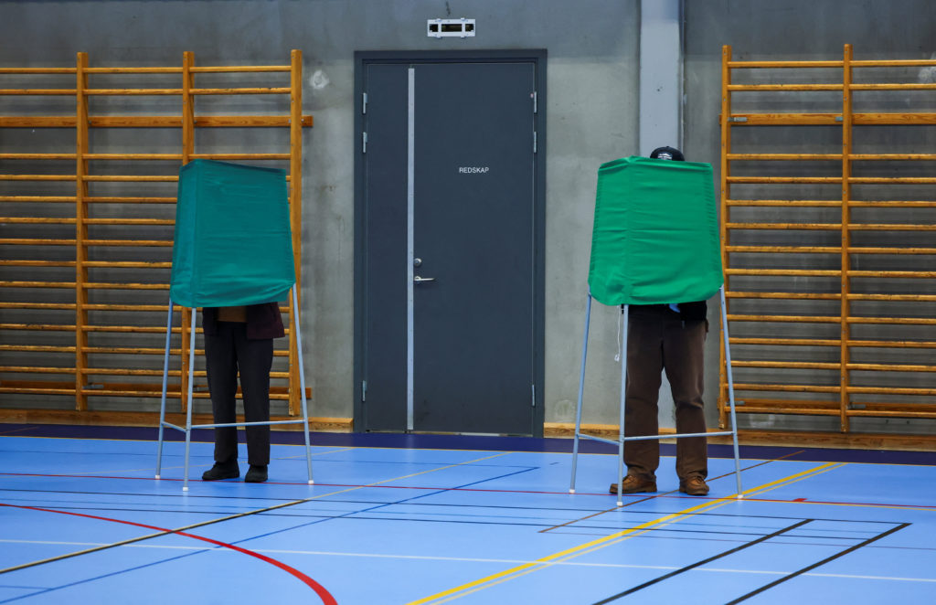 Source-feed image associated with Exit polls show left-wing opposition ahead in Swedish vote, projected to win majority