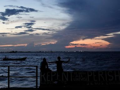 Source-feed image associated with Guyana police file murder charges against captain and crew mates in deadly ferry capsizing