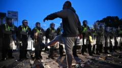 Source-feed image associated with Men jailed for violence at Henry Nowak police protest