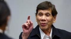 Source-feed image associated with Philippines' Duterte seen in person at International Criminal Court for first time