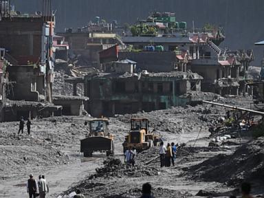 Source-feed image associated with Nepal-Tibet flood death toll rises to 750, officials say, more than 3,000 missing