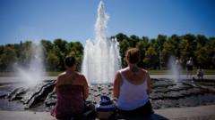 Source-feed image associated with Europe's deadly heatwave breaks German record and halts public events