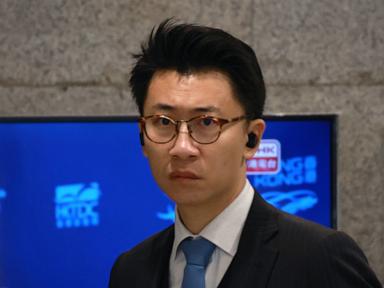Source-feed image associated with Hong Kong court convicts publisher of deterring reporter from taking union role
