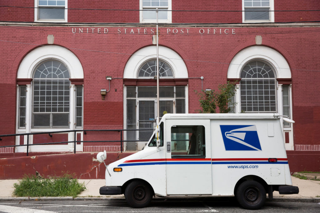 Source-feed image associated with Trump's attacks on mail balloting and concerns over delays turn midterms spotlight on Postal Service