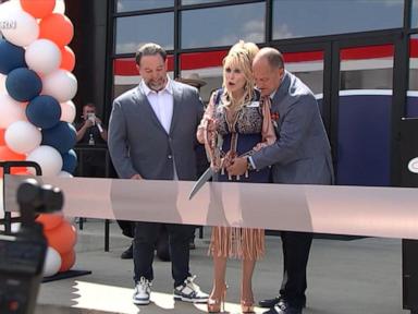 Source-feed image associated with WATCH: Dolly Parton makes surprise appearance at truck stop opening