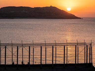 Source-feed image associated with Hundreds of migrants swim from Morocco to the Spanish territory of Ceuta