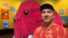 Source-feed image associated with Giant pink mammoth and Ceefax - Joe Lycett unveils first major solo art exhibition