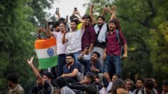 Source-feed image associated with India's 'cockroach' protest called off after education minister quits