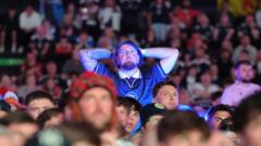 Source-feed image associated with Scotland fans dejected after loss to Morocco at World Cup