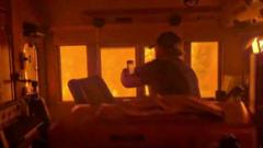 Source-feed image associated with Canada wildfires leave train 'encased in flames' as smoke drifts towards US