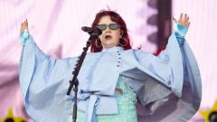 Source-feed image associated with CMAT shares 'deep sadness' over body-shaming abuse after Radio 1 Big Weekend set