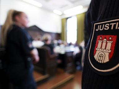 Source-feed image associated with German court sentences young members of right-wing extremist group to prison