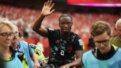 Source-feed image associated with A day of tears, scuffles and history as injury mars Canada's moment in World Cup