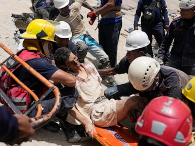 Source-feed image associated with Neighbors dig through Venezuela rubble to search for loved ones as death toll climbs