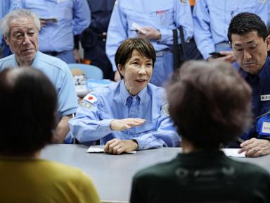 Source-feed image associated with Prime minister visits quake-hit southern Japan as cleanup begins in intense heat