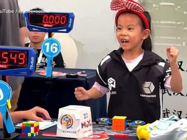 Image from linked report: WATCH: Six-year-old girl sets Rubik's Cube world record