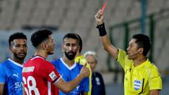 Source-feed image associated with With no team in World Cup, China fans rally around a red card-happy referee