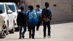 Source-feed image associated with Palestinian parents fear for children's lives at school as settler attacks grow