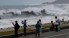 Source-feed image associated with East Asia braces for destructive typhoon as landslides kill 15 in Philippines
