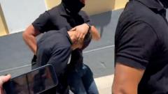 Source-feed image associated with Boxer charged with killing aid worker in Greece after his wife gave police 'key' details
