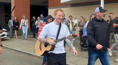 Source-feed image associated with Hundreds enjoy impromptu Ed Sheeran waterfront gig