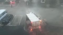 Source-feed image associated with Lorry turns over as typhoon hits China