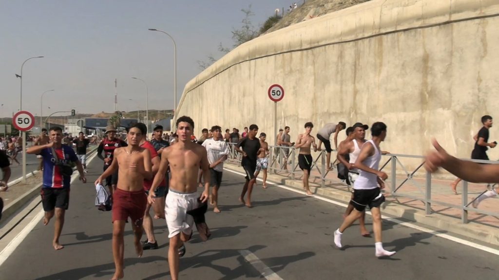 Source-feed image associated with Tens of thousands of migrants enter Spanish territory, then return to Morocco