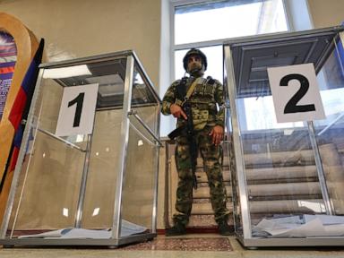 Source-feed image associated with Russian holds parliamentary vote in areas it seized from Ukraine in the war