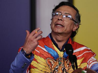 Source-feed image associated with As Colombia prepares for presidential inauguration, outgoing leader doubles down