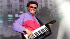 Source-feed image associated with Late singer Oliver Tree's body returned to US after helicopter crash