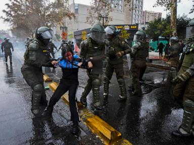 Source-feed image associated with Protesters clash with police in Chile's capital over President Kast’s education cuts