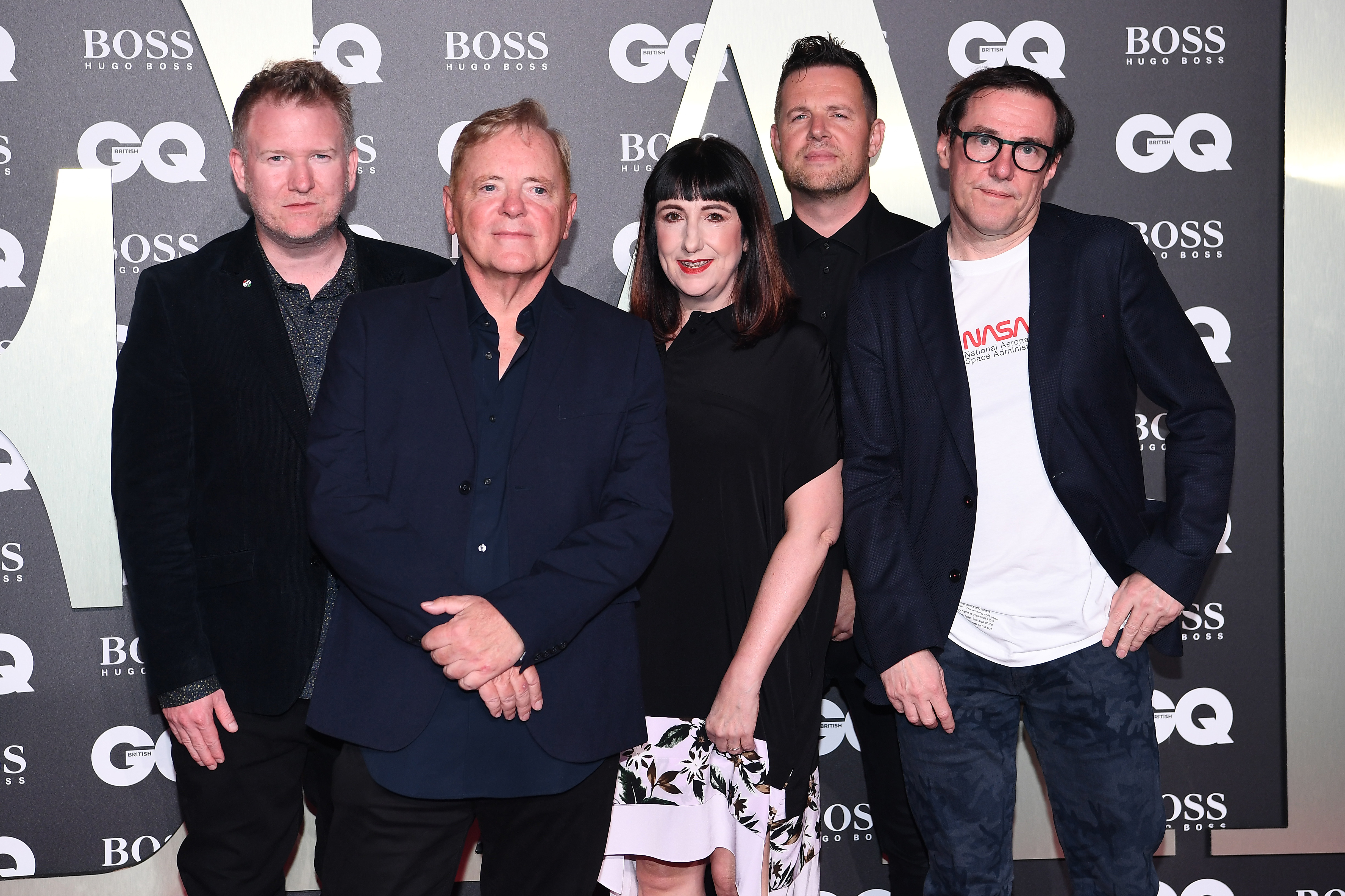 Source-feed image associated with Two Members of New Order Step Away From Touring ‘Due to Personal Health Reasons’