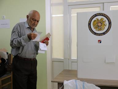 Source-feed image associated with Armenians go to the polls under Russian pressure aimed at preventing a drift toward West