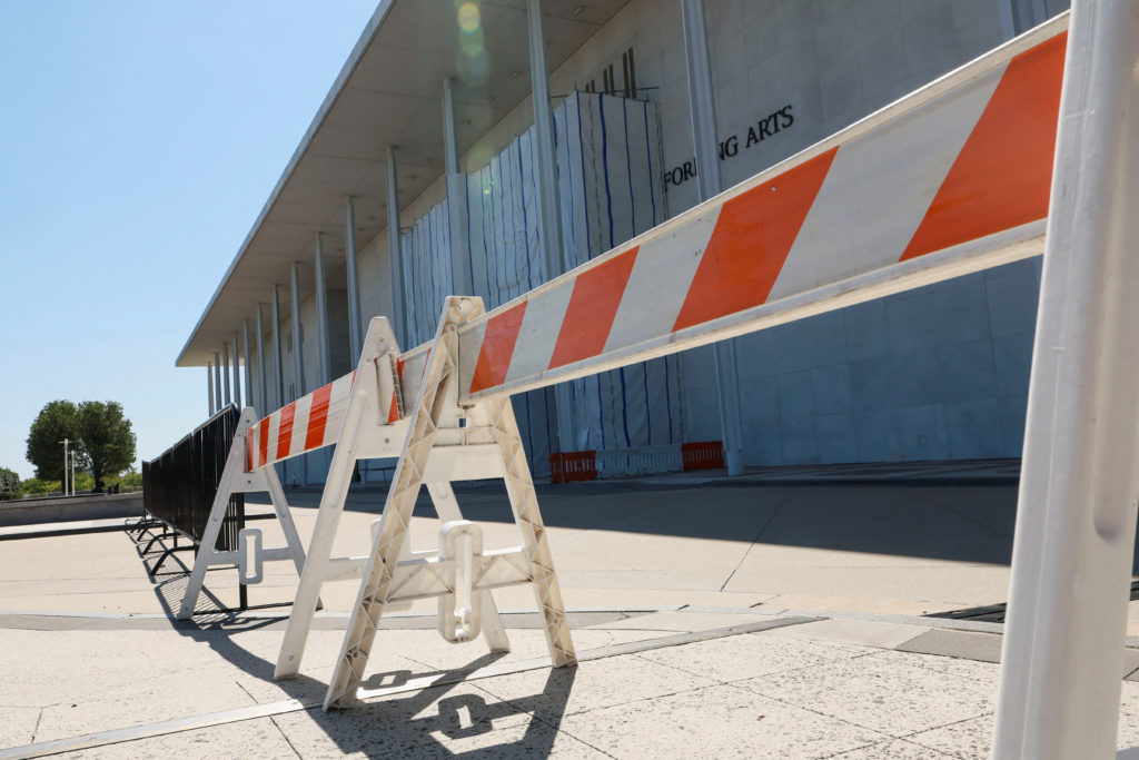 Source-feed image associated with Fencing goes up around the main Kennedy Center building after Trump-aligned board votes to close it
