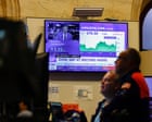 Source-feed image associated with US stock market hits record highs as AI profits pile and oil prices ease