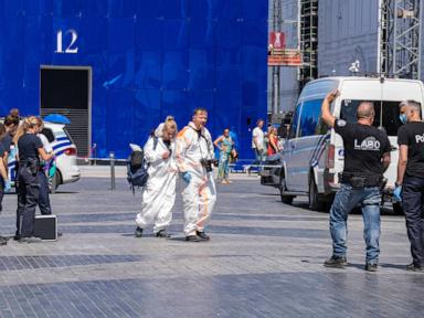 Source-feed image associated with Authorities looking for 6 missing in a Brussels building fire find charred bodies in a lift