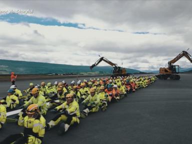Source-feed image associated with WATCH: Construction workers perform 'Viking Row'