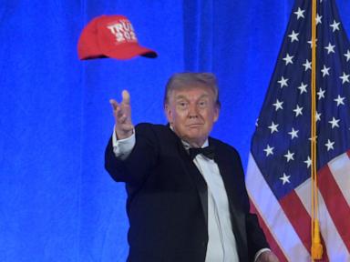 Source-feed image associated with Trump defends his sweeping tariffs and watches 'America First' drag races during Michigan stop